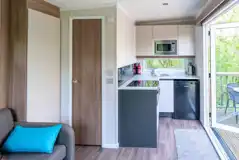 Hideaway pod kitchen with hob, grill, microwave, fridge, toaster and kettle