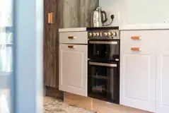 Family hideaway kitchen with hob, dishwasher, microwave, fridge, toaster and kettle