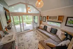 Family hideaway living area with a TV and kitchen