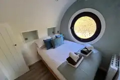Usk glamping bedroom with bedding and towels provided