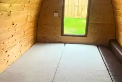 Camping pod with the bed and mattresses made up Camping pod with the bed and mattresses made up