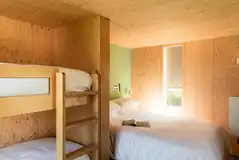 Camping cabins with a king bed and bunks (bedding provided) Camping cabins with a king bed and bunks (bedding provided)