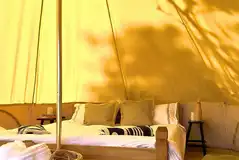 Bell tent king bed and single chair beds (bedding and towels not included) Bell tent king bed and single chair beds (bedding and towels not included)
