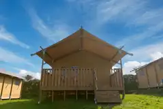 Safari tent with a covered outdoor deck Safari tent with a covered outdoor deck