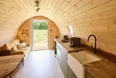 Kitchen with hob, oven/grill, microwave, coffee machine and fridge