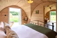 Coppice king size bedroom with a glass door to the patio