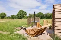 Coppice outdoor lounge chairs, fire pit and hot tub