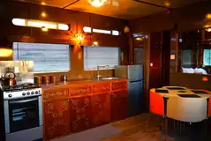 The Showman's Wagon (Lola) kitchen and dining space The Showman's Wagon (Lola) kitchen and dining space