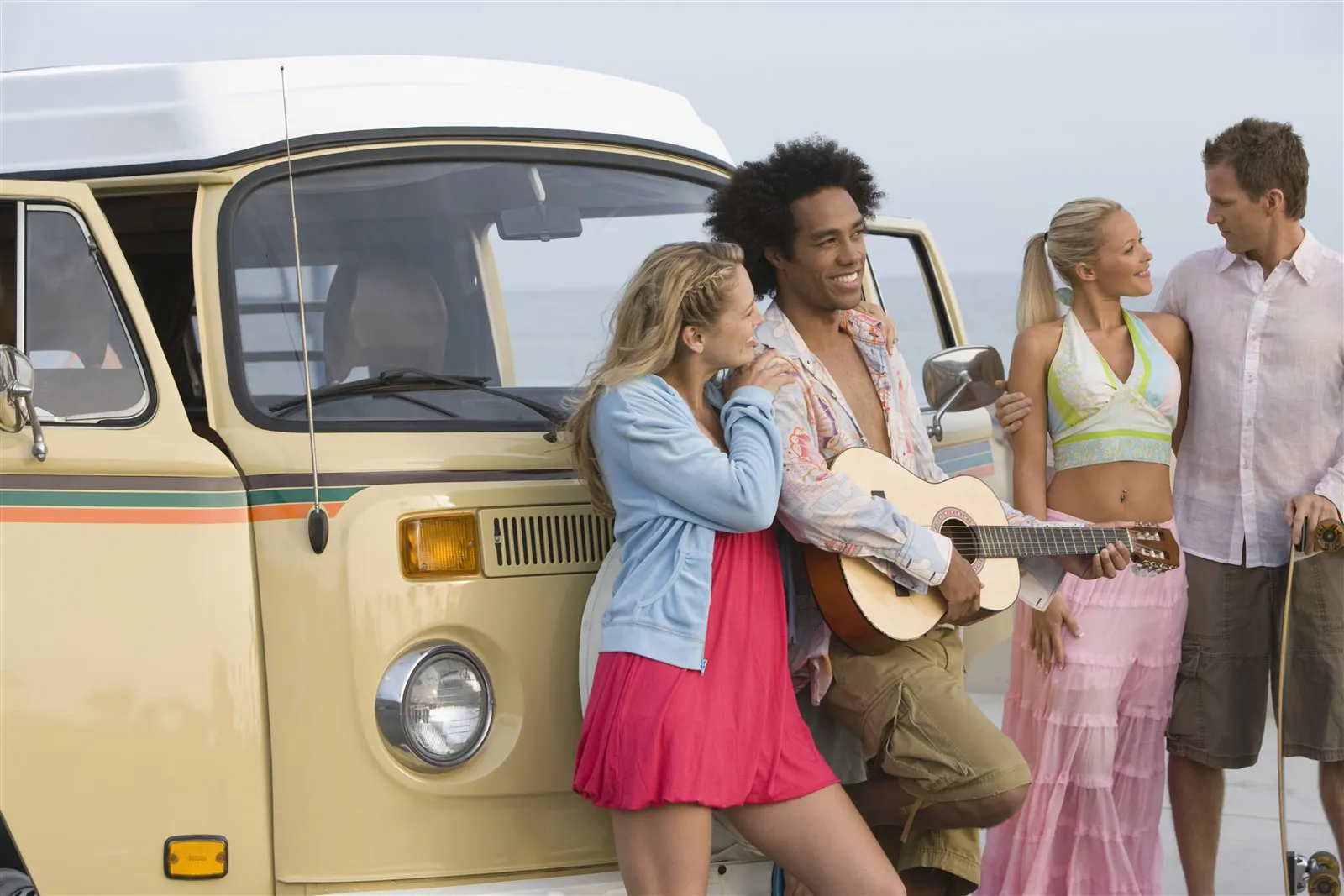 Group of people in front of a VW campervan