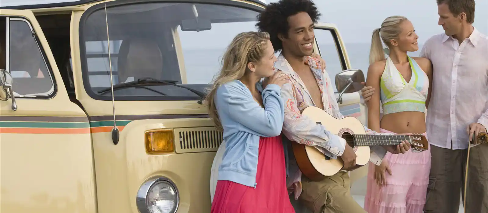 Group of people in front of a VW campervan