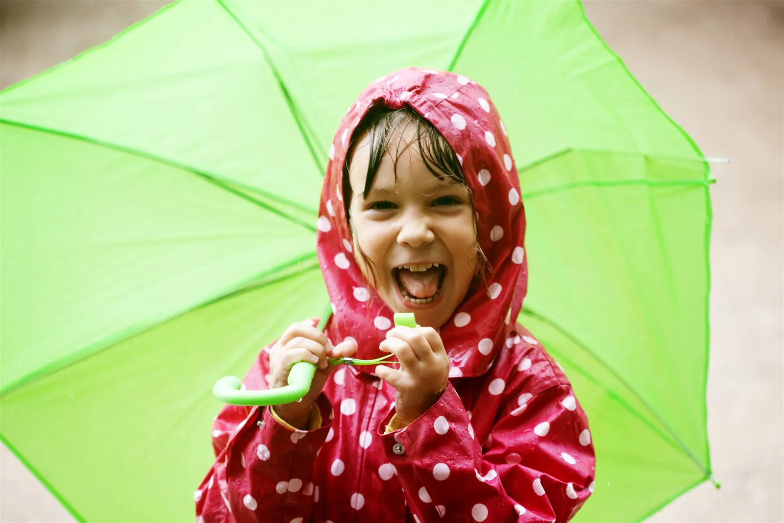 Child walking in the rain