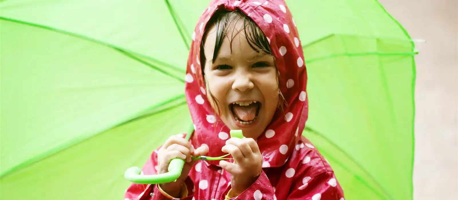 Child walking in the rain