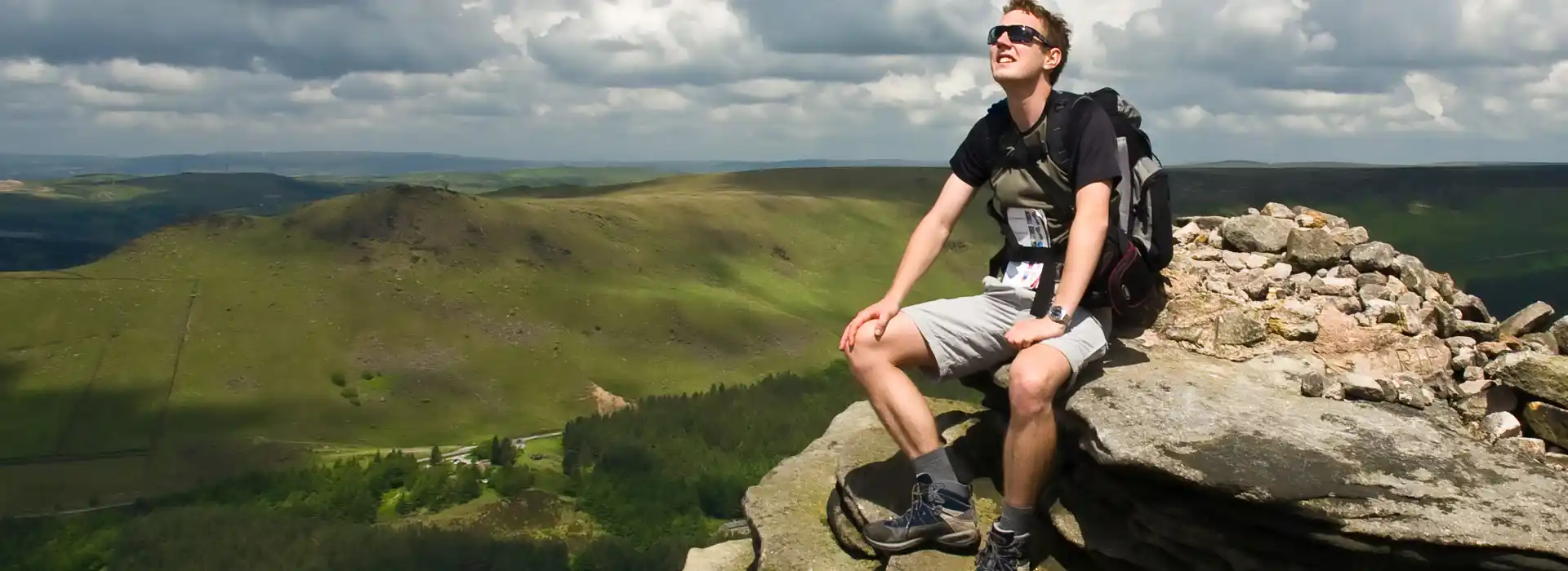 Young man on mountain peak