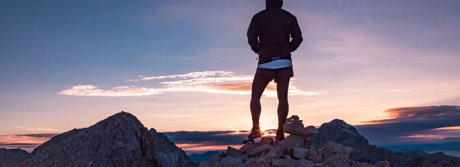 Champion adventurer on the top of climbing rock