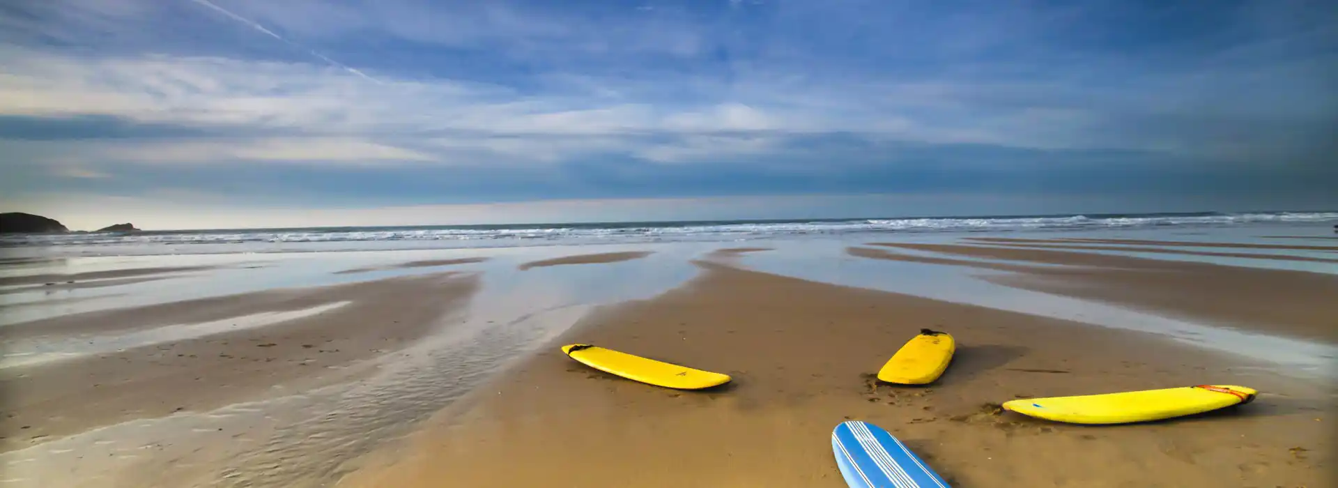 Colourful surf boards by sea in Cornwall